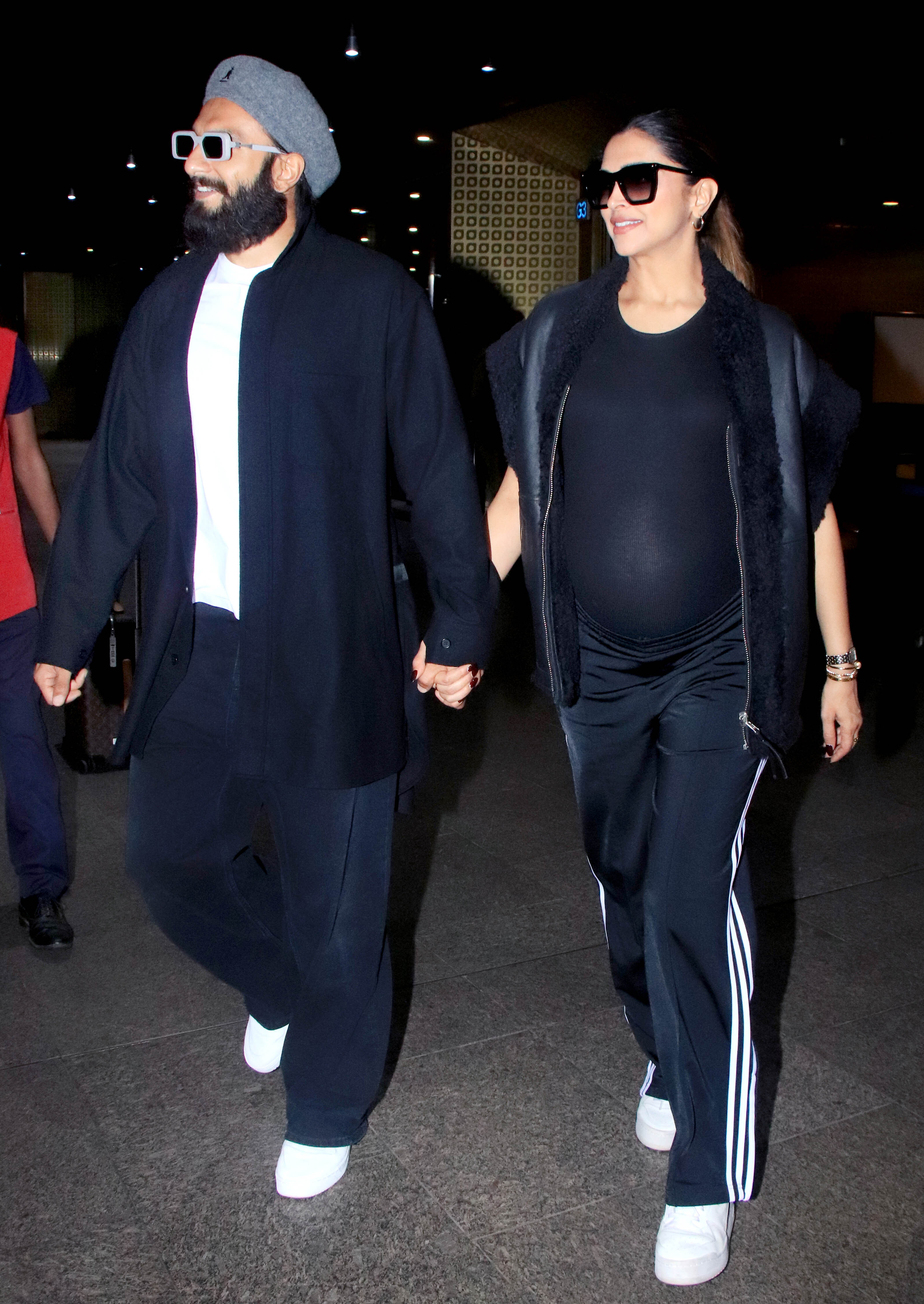 Deepika in a sporty look: sweatpants, a tight T-shirt and a jacket.