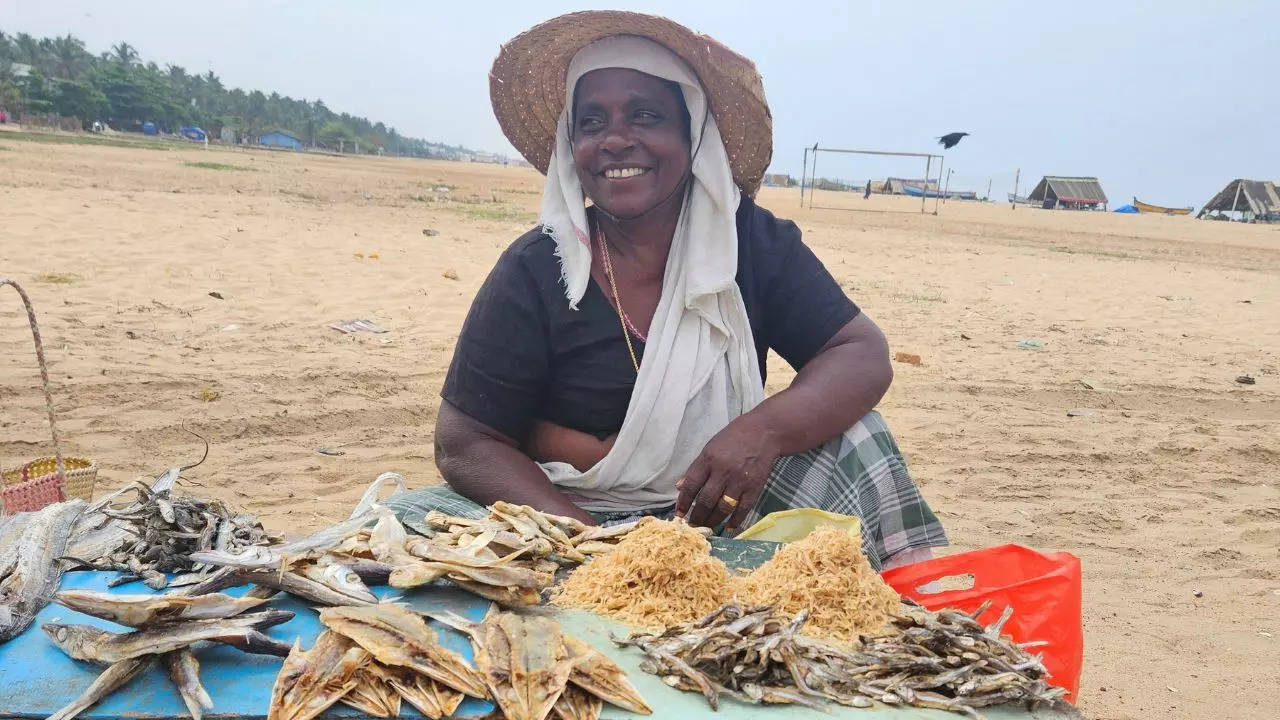 A woman selling dried fish in Karumkulam, Kerala